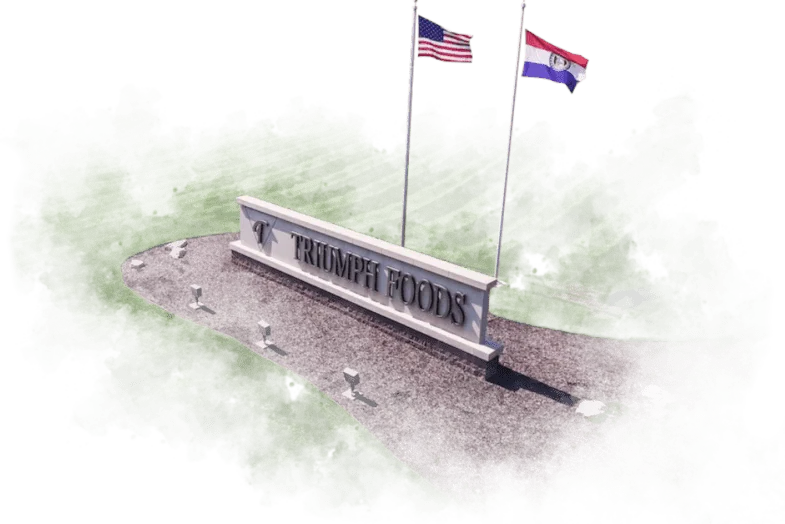 Triumph Foods sign with flags at the plant entrance