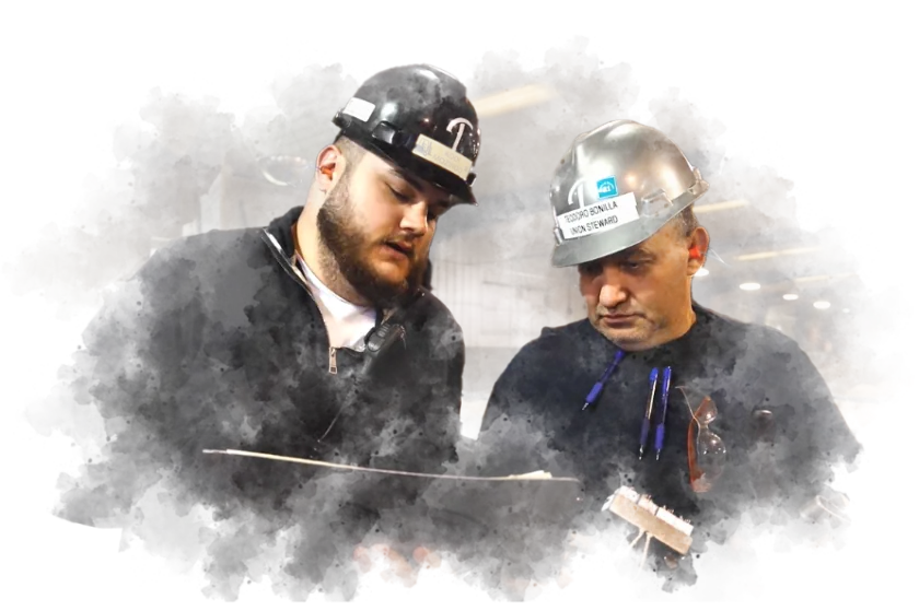 Two Triumph Foods team members in hard hats